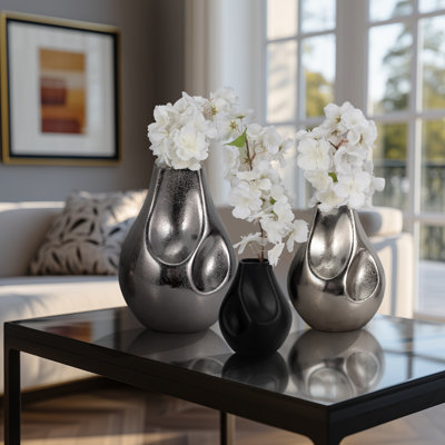Elevarre Accentuate Your Space With This Vase Trio In Gleaming Silver, Perfect For Modern Home Decor.