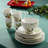 Holly and Vines Christmas Dinnerware Set – 16-Piece Stoneware Service for 4 with Artist-Designed Holiday Plates, Mugs & Bowls, Elegant Tableware for Christmas Hosting & Winter Entertaining