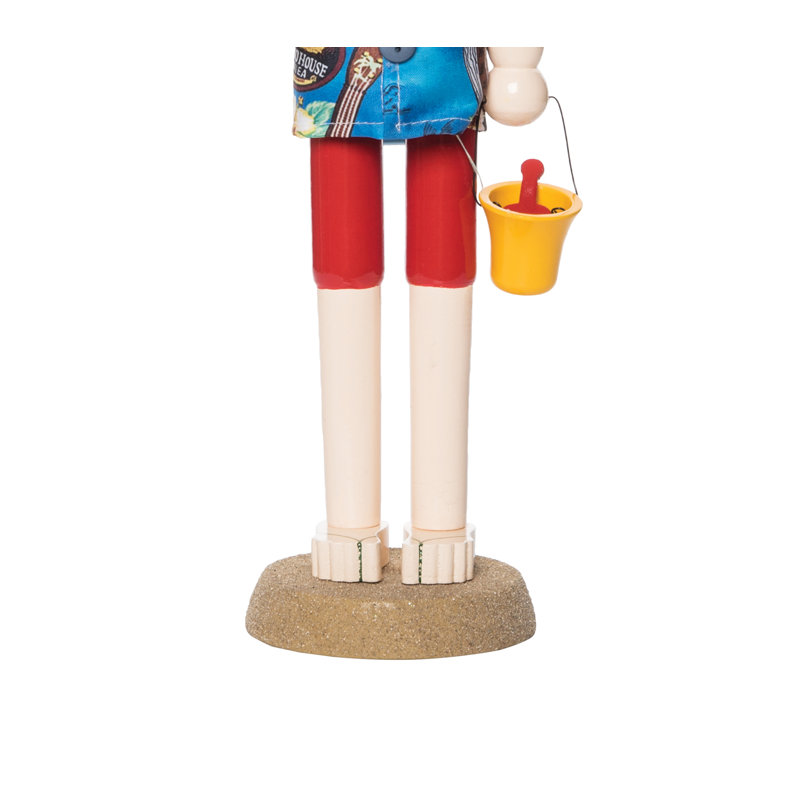 Figurine de plage avec seau de plage