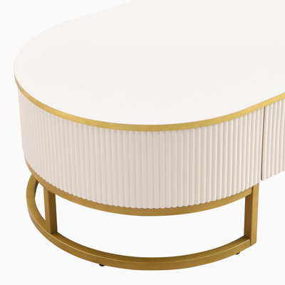 Table basse ovale avec tiroirs, design incurvé et décor en métal doré