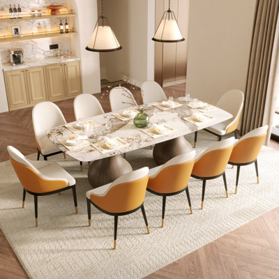 Ensemble de salle à manger moderne 10 personnes, table de salle à manger rectangulaire pré-assemblée, plateau de table en pierre frittée et piédestal à tréteaux, chaises rembourrées en similicuir