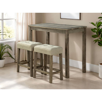 Ensemble de salle à manger moderne 3 pièces avec tabourets capitonnés et table compacte à hauteur de comptoir pour petits espaces.