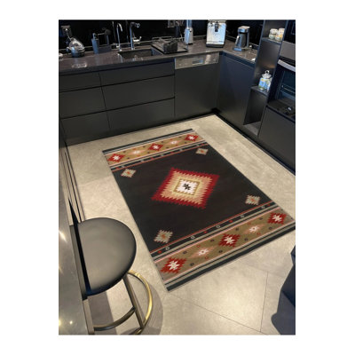 Tapis décoratif multicolore en osier à motif géométrique