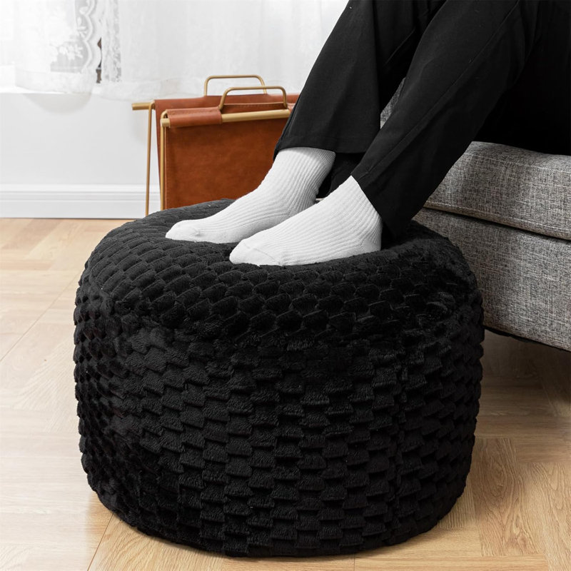 Pouf rond noir avec rembourrage en mousse