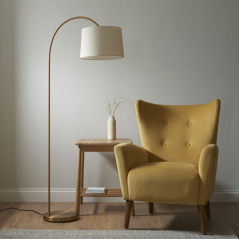 Thackinh Floor light finished in Warm Brass and Cream