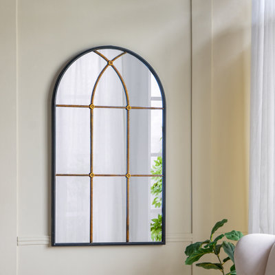 Miroir mural arqué noir et doré
