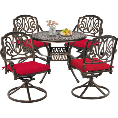 Ashritha 4 - Person Patio Dining Set with Round Table , Cushions Included