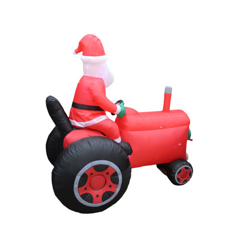 The Holiday Aisle® Santa on Tractor Inflatable | Wayfair