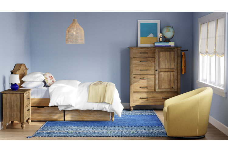 kids bedroom with matching wood bedroom set bed nightstand and wardrobe with blue bedding and blue area rug