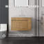 Meuble-lavabo suspendu de 76 cm avec lavabo, porte à fermeture amortie, comptoir et dosseret en marbre synthétique blanc de Carrare de 5 cm, contreplaqué
