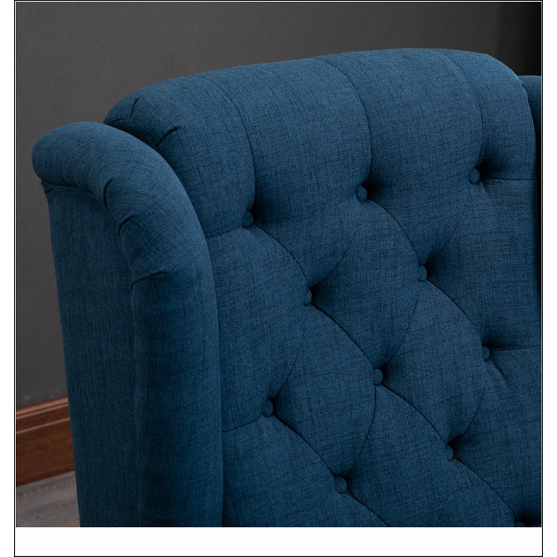 Fauteuil d'appoint capitonné à dossier haut