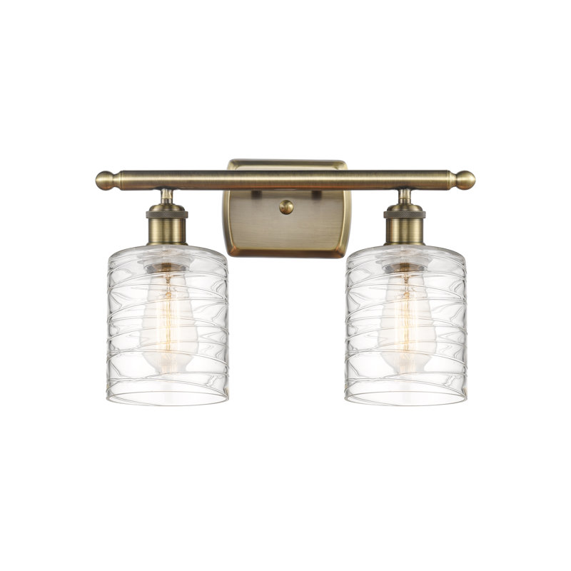 Leilani 2 - Light Dimmable Vanity Light, Antique Brass, Clear Deco Swirl, 6 Watt Vinage LED Bulb