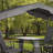 Sojag Houston 4-Seat Outdoor Glider With Canopy, Weather-Resistant Aluminum Frame, Tempered Glass Top Table and Footrest Included, Charcoal