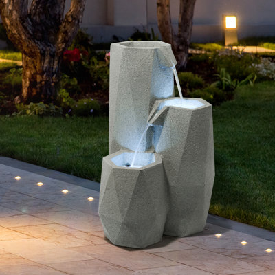 Fontaine géométrique blanche à 3 niveaux en résine résistante aux intempéries avec éclairage DEL