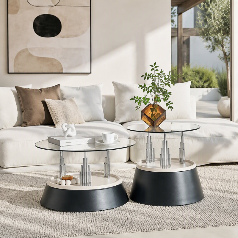 Affordable luxury black nesting coffee table set. Transparent tempered glass nesting set. Round living room coffee table, two-piece set.