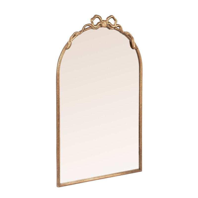 Miroir arqué en fer doré avec nœud décoratif