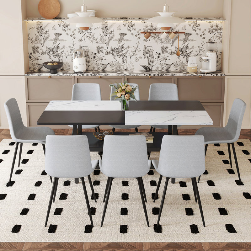 Ensemble de table et de chaises 71 x 35,4 pouces avec table de salle à manger épissée blanche et noire avec fonction de rangement au milieu des pieds de la table.