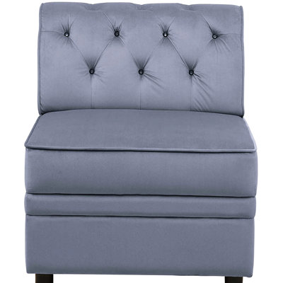 Fauteuil chic sans accoudoirs gris revêtu de velours avec un capitonnage à boutons intrigant