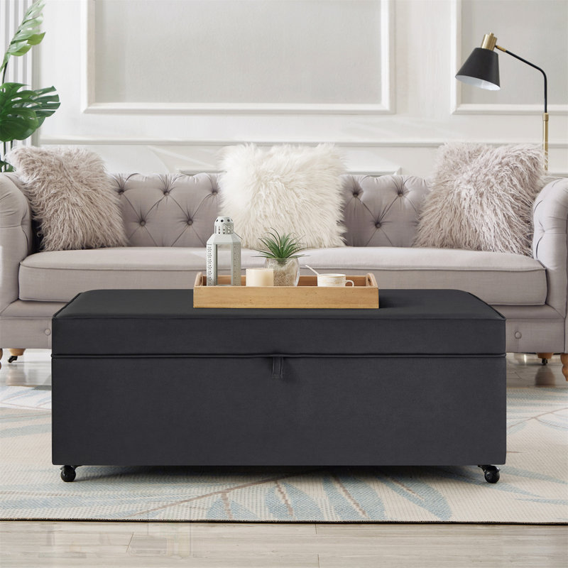 Grand canapé-lit moderne et confortable avec rangement et banc modulaire polyvalent avec roulettes et un rangement dissimulé pour l'organisation du salon
