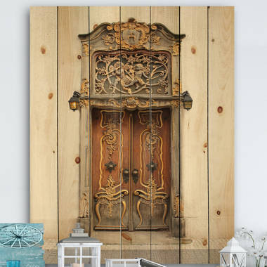 Old Door With Gold Ornaments On Wood Print