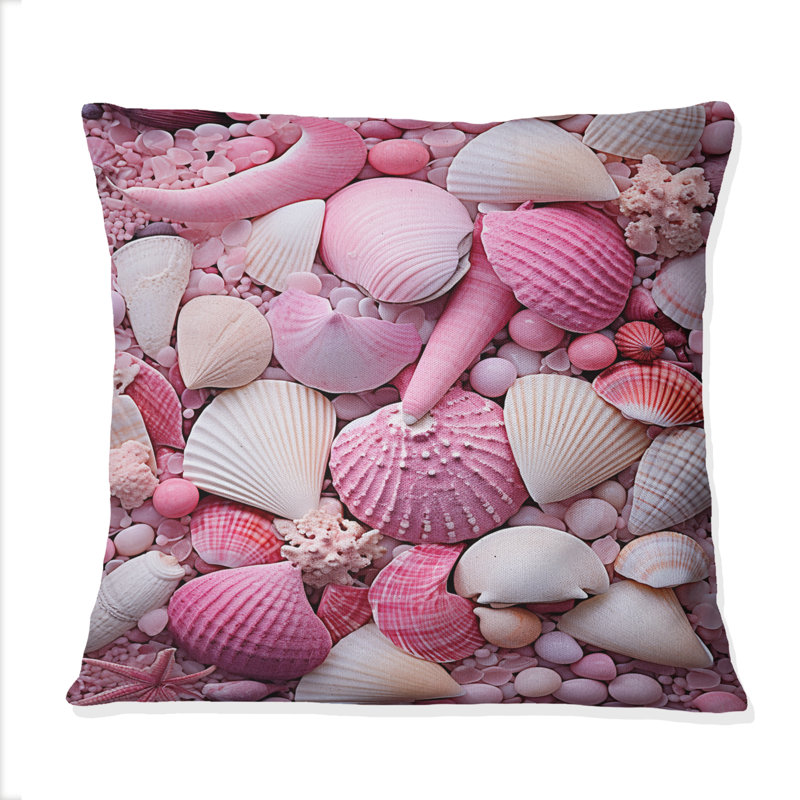 Coussin rose à imprimé coquillage rose sur la plage