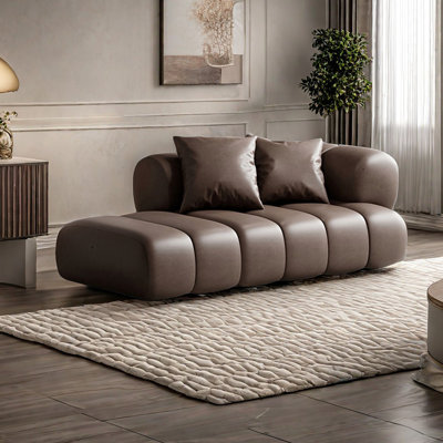 Chaise longue à large assise en similicuir
