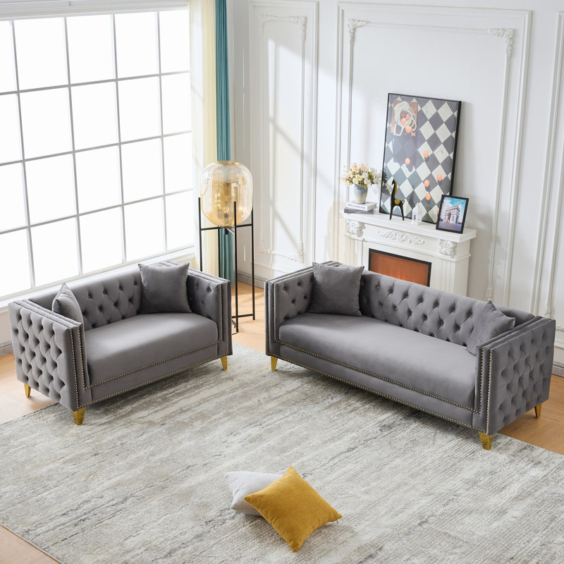 Canapé Chesterfield confortable en velours au design traditionnel et élégant, parfait pour le salon