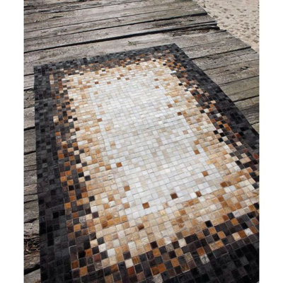 Tapis taupe / ivoire en cuir Verona