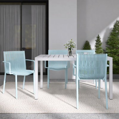 4-Person Patio Dining Set with White Rectangular Table, Stackable Polypropylene Armchairs for Indoor/Outdoor Use