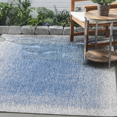 Tapis intérieur / extérieur bleu en polypropylène tissé à la machine Rectangle Waxter