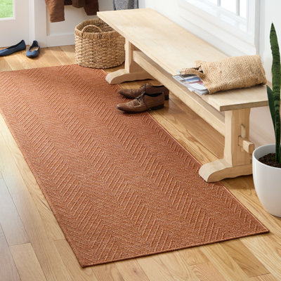 Tapis rouille texturé uni Tax