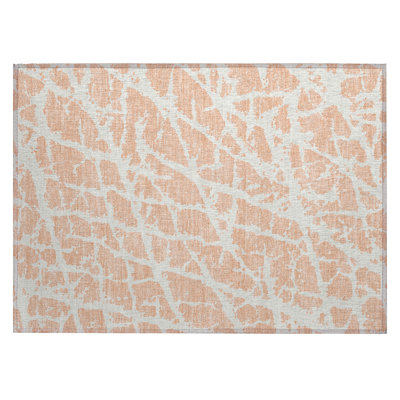 2' X 3' Peach and Ivory Abstract Washable Non Skid Indoor Outdoor Area Rug