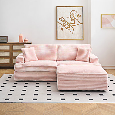 Canapé rembourré avec repose-pieds et coussins décoratifs