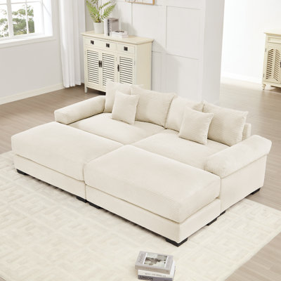 Canapé d'angle modulaire surdimensionné Cloud, tissu doux avec pouf, assise profonde, larges accoudoirs, design ergonomique, montage facile, velours côtelé doux, pour salons et pièces à vivre.