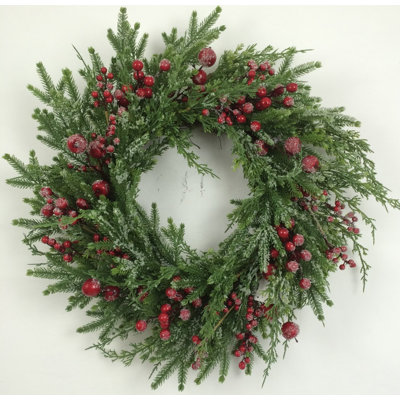 Couronne de Noël en verdure avec baies
