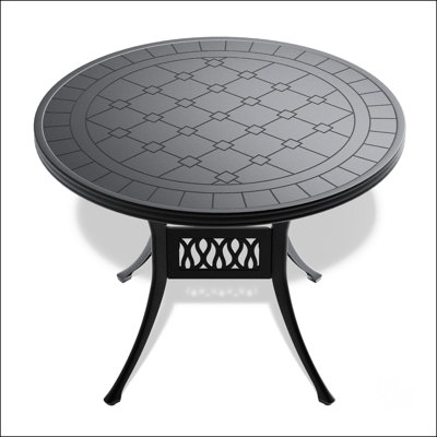 Table de salle à manger élégante en fonte d'aluminium avec une texture sculptée exquise et une finition résistante aux intempéries, parfaite pour les réceptions en plein air.