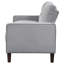 Canapé compact gris rembourré, silhouette classique et pieds fuselés, idéal pour les petits appartements. Accoudoirs et dossier carrés, confort optimal.