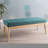 Teal Upholstered With A Birch Wood Leg Frame For Enduring Use Button- In Fabric, Resting On Four Splayed Legs