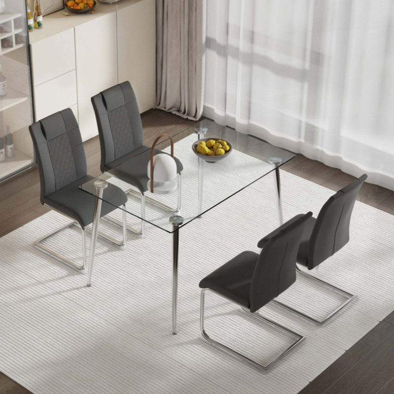 Ensemble de table et de chaises. Ensemble de table à manger en verre, ensemble de chaises, 4 chaises et 1 table.