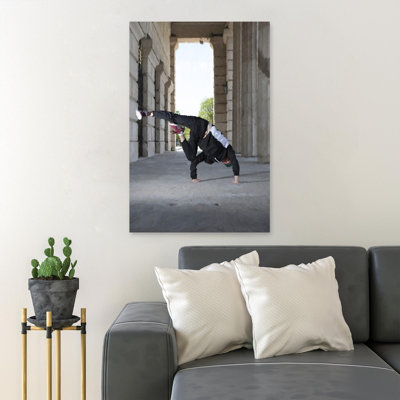 " Man Doing Tricks Near Building "