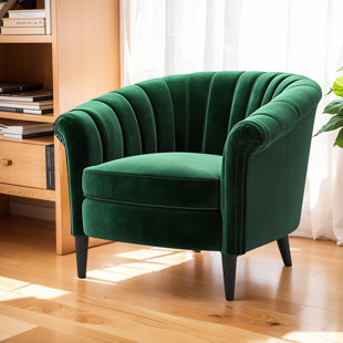 Fauteuil en velours vert foncé