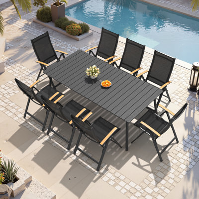 Ensemble repas pour 8 personnes avec structure en aluminium et fauteuils inclinables pliés