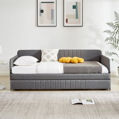 Lit de jour gris simple avec lit gigogne et structure en fer pour une chambre à coucher élégante et pratique