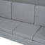 Grand lit gris avec option de couchage polyvalente pour maximiser le nombre de pièces