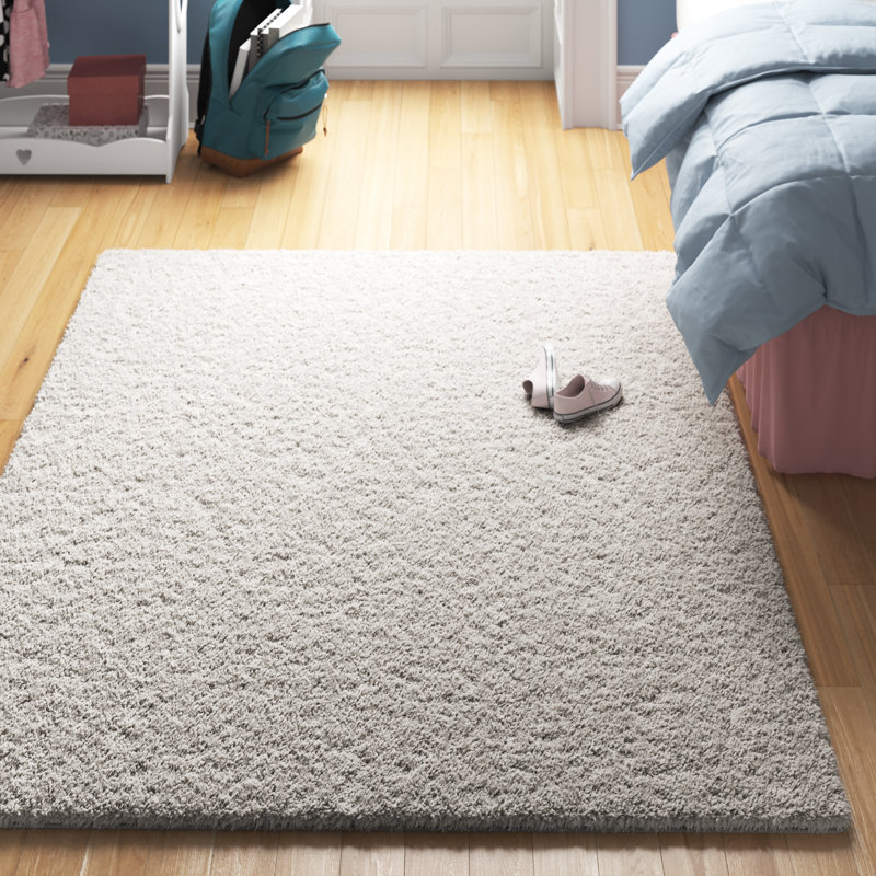 Ashleigh-Marie Solid Color Machine Woven Polypropylene Area Rug in Light Gray, Rectangle 6'7" x 9'