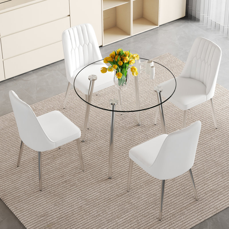Ensemble de salle à manger de luxe moderne avec table en verre et cadres en métal argenté pour des espaces de vie polyvalents