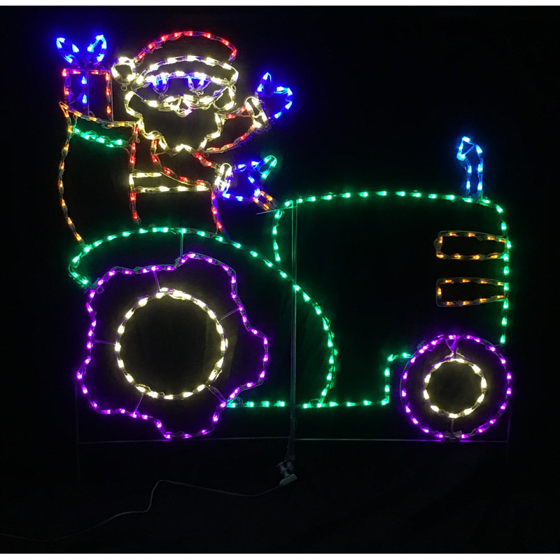 Père Noël au volant d'un tracteur lumineux