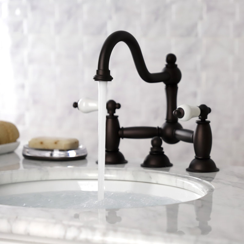 Kingston Brass Restoration Two-Handle 3-Hole Deck Mount Bridge Bathroom Faucet with Brass Pop-Up, Oil Rubbed Bronze