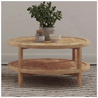 Table basse ronde en bois avec tablette inférieure, fabrication en bois d'hévéa durable et conception en forme de plateau pour un style et un rangement améliorés.