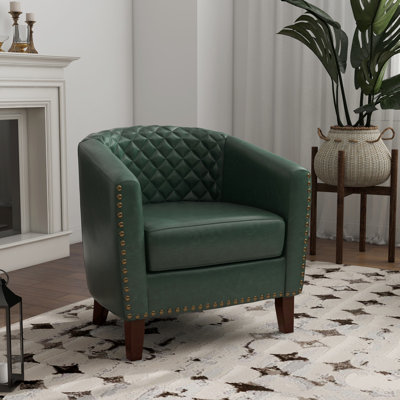 Fauteuil demi-tonneau capitonné avec garniture cloutée Edvardas